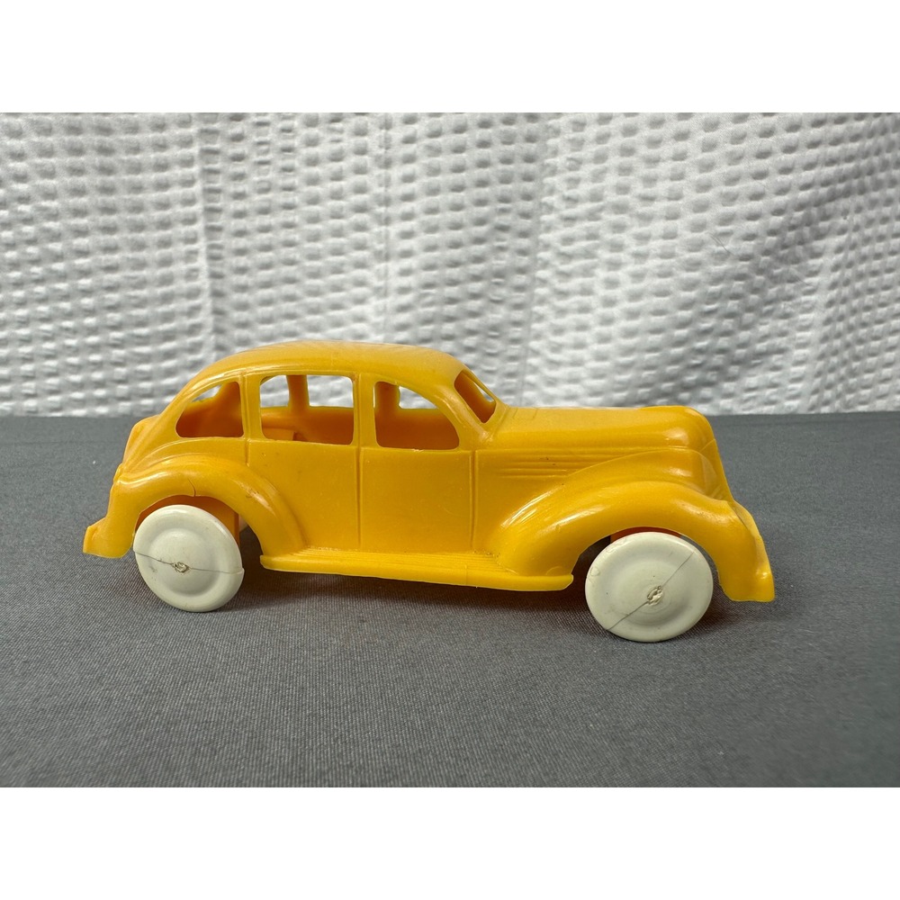 Lapin 1940s Yellow Soft Plastic 4" Toy Car Coupe.